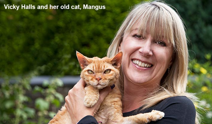 Vicky Halls holding her old cat Magnus